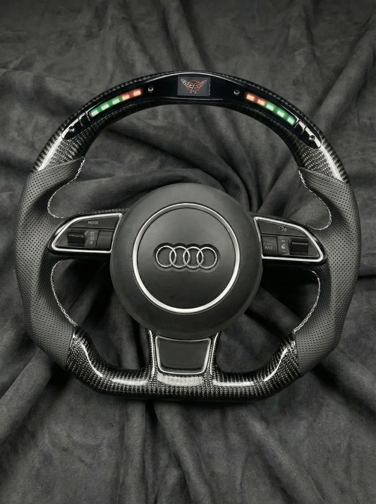 Steering wheel with Audi logo on a dark background