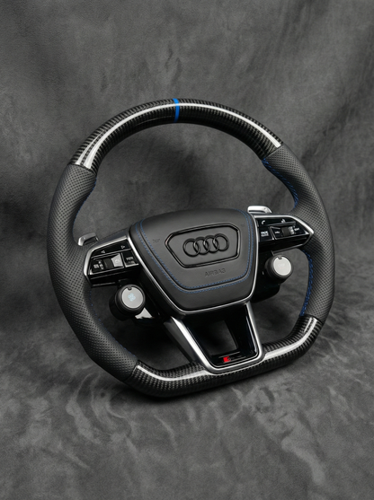 Audi steering wheel on a gray background