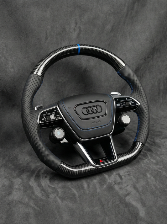 Audi steering wheel on a gray background