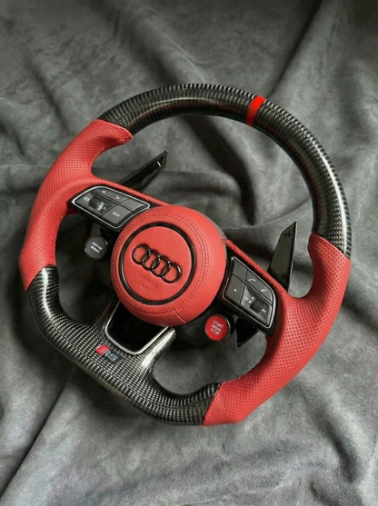 Red Audi steering wheel on a gray background