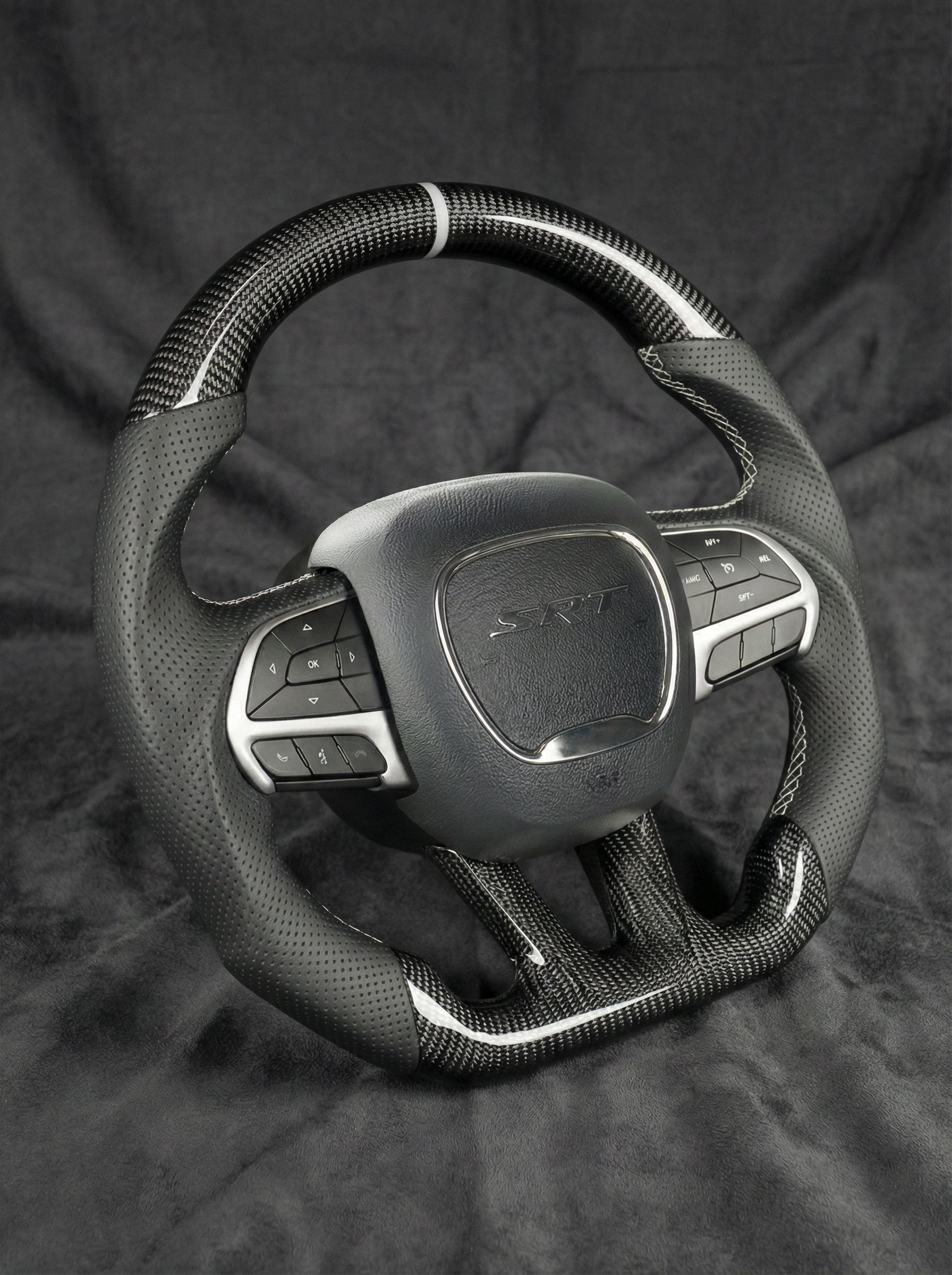 Car steering wheel with 'ST' logo on a dark background