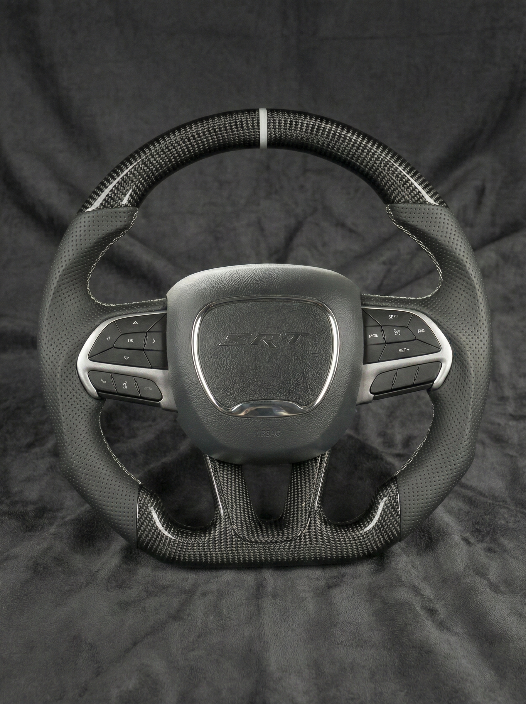 Steering wheel with 'Lexus' logo on a black background