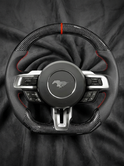 Car steering wheel with Mustang logo on a dark background